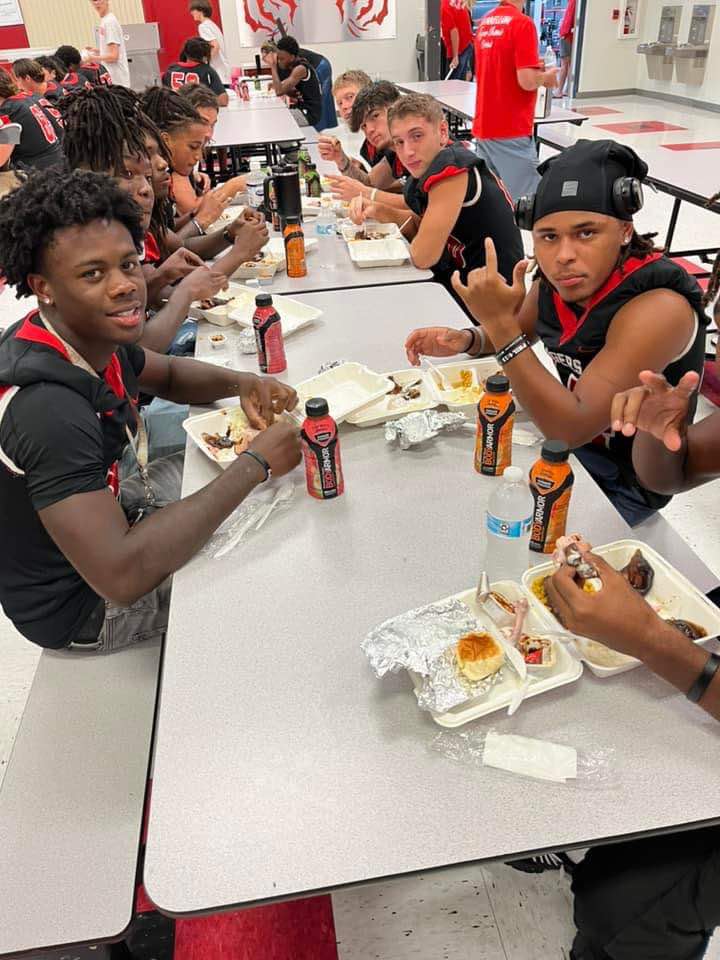 DHS Football players eat a big meal before the game