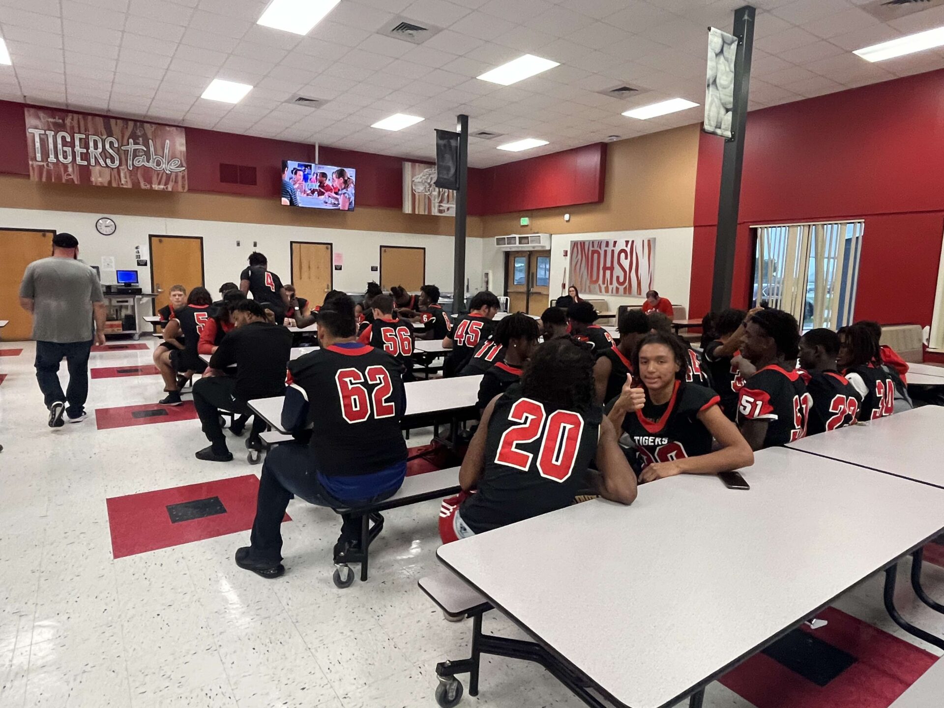DHS Football players sit patiently waiting to be fed