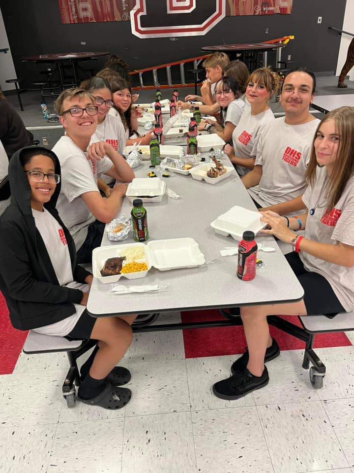 Dunnellon high School Band Members enjoy a meal before the game