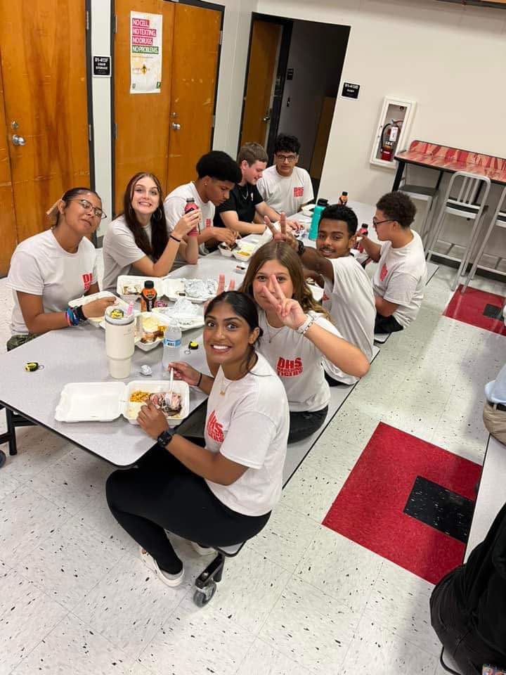 The DHS band enjoying a meal before they perform