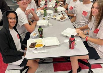 Dunnellon high School Band Members enjoy a meal before the game