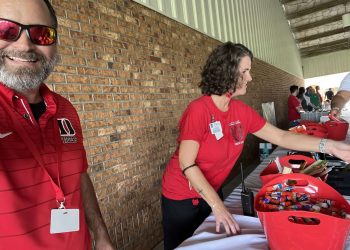 Pastor Tom at DES handing out free school supplies