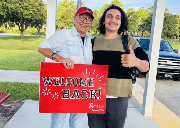 Serve Team Volunteer and DHS Student Kaleb Baldeo stand next to eachother on the first day of school in 2024