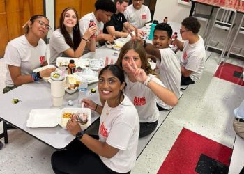 The DHS band enjoying a meal before they perform