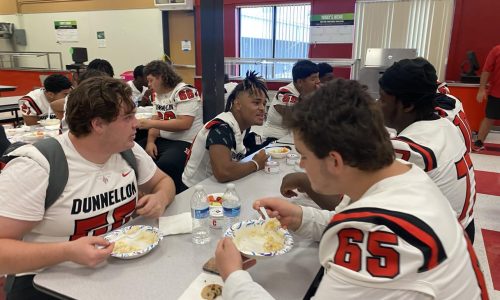 dhs student athletes eat food before a home game.